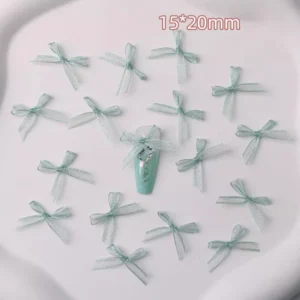 Mint green lace bows with glossy pastel nail example