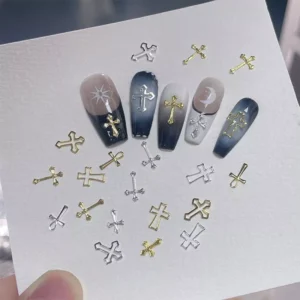 Handheld card displaying silver and gold cross nail decorations