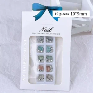 Assorted rhinestone nail decorations packaged in a professional box