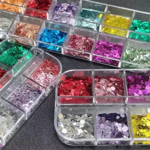 Mixed shape glitter sequins in various compartments with round and bar cuts