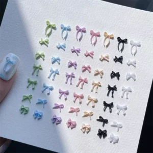 Full set of assorted bow nail decorations in pastel and black tones