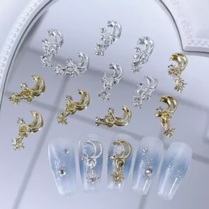 Moon and star nail charms displayed beside press-on nails with iridescent finish