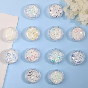 Multi-color nail glitter powder set arranged on blue background