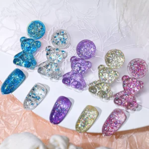 Display of purple, gold, and blue glitter gel on resin bears and swatches
