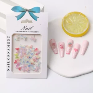 Package of pastel rainbow bow nail charms with manicure samples
