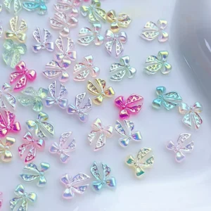 Mixed resin bow nail charms with cut-out details in various colors