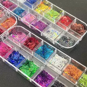 Assorted holographic glitter nail sequins organized by color
