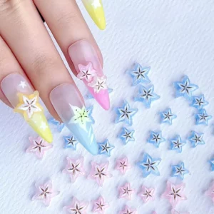 Full nail set styled with multicolor pastel starfruit charms in blue, pink, and yellow
