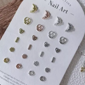 Full nail charm set organized by color and shape on a white card