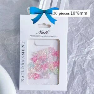 Iridescent resin bow nail charms packaged in professional nail ornament set
