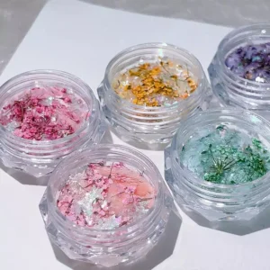 Shell Glitter Nail Charms in pink, yellow, green and purple tones with floral textures