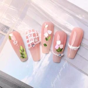 Nature-inspired nail decorations using white and green petal nail art sequins