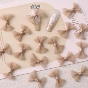 Nude beige mesh bows for subtle and chic nail art
