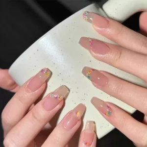 Elegant nude nails with embedded dried flower nail decorations