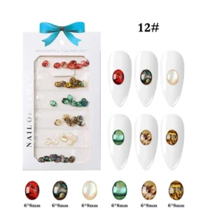 Oval resin nail charms in vibrant gemstone hues with polished domed finish, including red, green, pearl, and amber