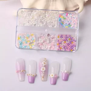 Pastel candy beads and 3D floral nail decorations in organized box