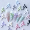 Bow Ribbon Nail Charms - Elegant, Multiple Colors Available 9 Bow ribbon nail charms in pastel colors on soft gradient nails