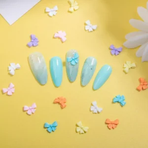 Mixed pastel bow nail decorations in medium size