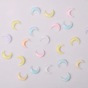 Kawaii crescent moon nail charms in pastel shades of resin