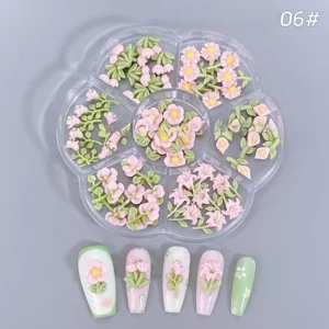 Leaf-accented pastel pink blossom charms in resin tray