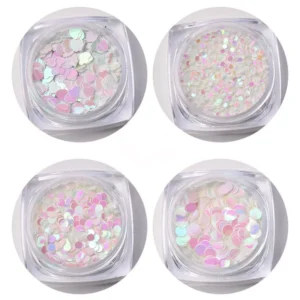 Pink-toned round iridescent nail sequins in close-up view