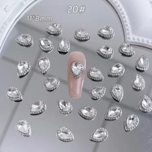 Oval pear-shaped rhinestone nail charm on nude base