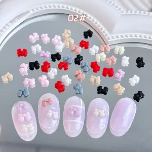 Pastel pearlescent bow nail charms with soft shimmer finish