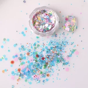 Chunky holographic nail glitter in blue and pastel pink with floral shapes