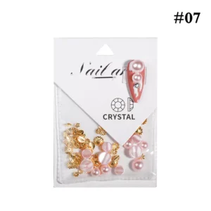 Pink bubble-effect pearls and gold decorations for nails