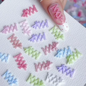 Pink ballet lace-up nail charm applied on nail with matching pieces