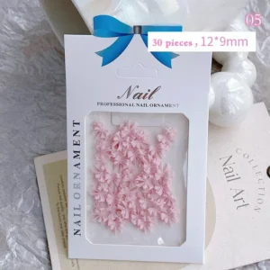 Light pink pastel 3D nail bows made from resin, neatly arranged