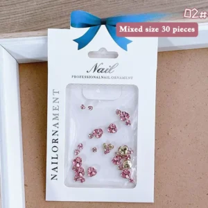 Pink rhinestone nail clusters in decorative packaging for salons