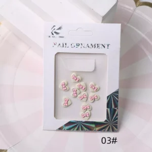 Pink bow heart nail embellishments arranged in packaging display (03#)