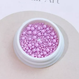 Pink nail beads in glossy finish for textured nail art