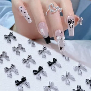 Close-up of Plaid Bow Nail Charms in various monochrome patterns with 3D detail