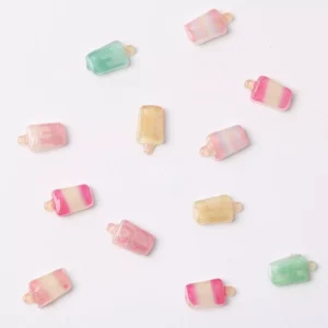 Rectangular popsicle nail charms in pastel yellow, green, and pink