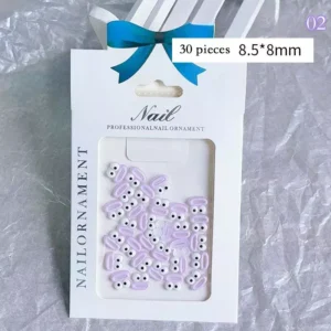 Purple funny monster nail charms with round eyes in gift packaging