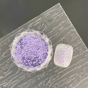 Purple heart-shaped glitter for stylish nail decoration.