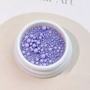 Purple 3D nail caviar in assorted sizes for nail art