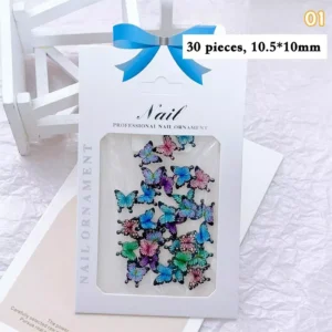 Black-edged rainbow butterfly nail charms in vibrant blue, green, and pink hues