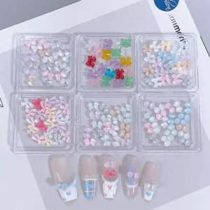 Iridescent and rainbow bow nail charms in transparent candy colors