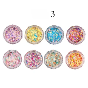 Eight pots of rainbow glitter flakes in hexagonal crystal jars