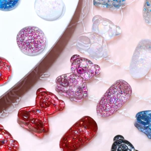 Red and pink glitter bear charms paired with matching nail swatches