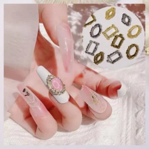 Clear pink nails decorated with vintage oval frame and gemstone centerpiece
