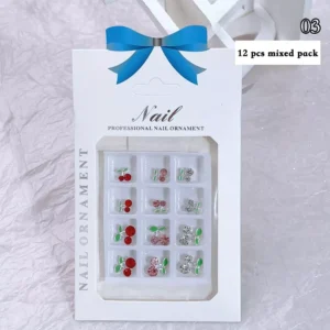 Cherry-themed nail charms in red, pink, and clear rhinestone styles