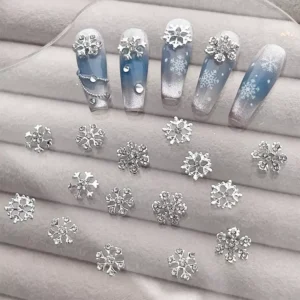 Rhinestone snowflake nail charms with winter nail art