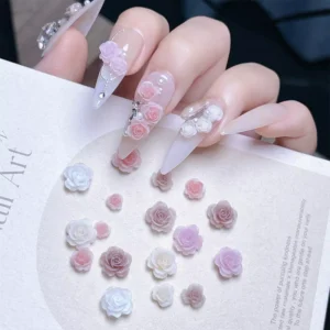 Romantic Rose Nail Charms in pastel pink and white - styled on long stiletto nails