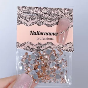 Rose gold flatback nail crystals with iridescent AB shimmer