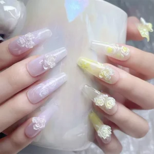 Iridescent 3D floral sparkle nail art with pastel purple and lemon-yellow tones