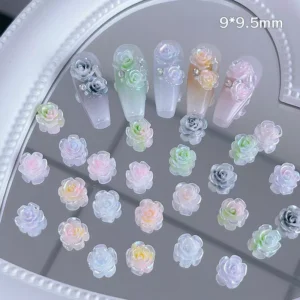 Floral nail charms displayed with green leaf accent